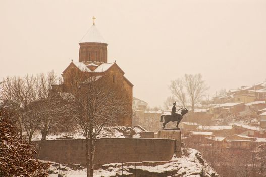 Winter view to covered with snow Tbilisi Old town in misty day