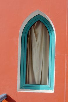 Arabic architecture: window on the red wall                  