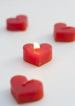 Heart-shaped candles. meaning of love or get married