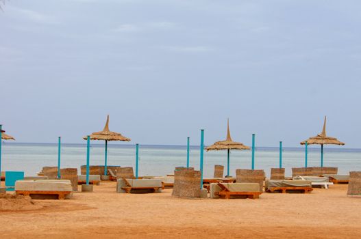 Sun beds and umbrellas on the beach     