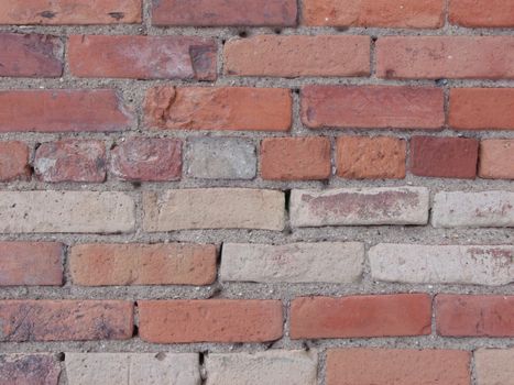Multi-toned brick with some mortar randomly missing yielding an interesting look and texture.