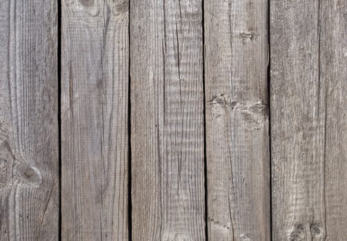 Fragment of old gray wooden boards background