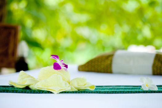 spa objects with tropical flowers and leaves