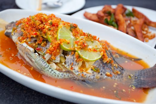 Fish food arranged on a white plate