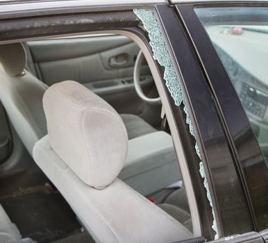 Car wreck causing a broken window. Can show auto safety, insurance industry, or even theft and vandalism