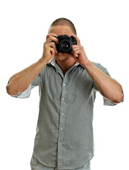 Man taking pictures with retro camera. Isolated on white.