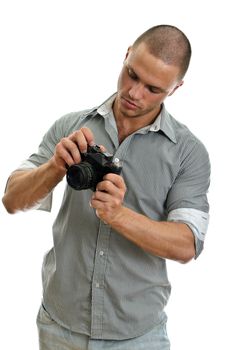 Man taking pictures with retro camera. Isolated on white.