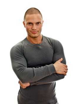 Sporty male with arms folded. Isolated on white.