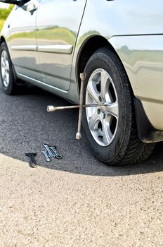 Tire change on a road close up.