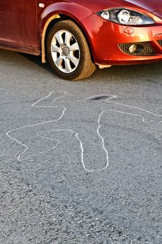 Contour of a person drawn at the asphalt