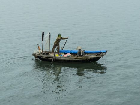 Vietnamese fisherman boat. Ha Long Bay.(EDITORIAL)