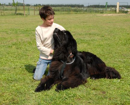 young girl and her best friend neawfoundland dog