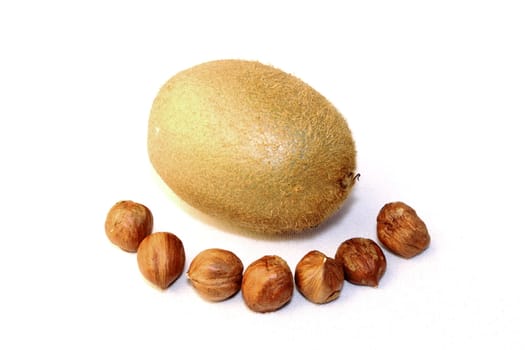 some hazelnuts are excelent to eat with a kiwi fruit