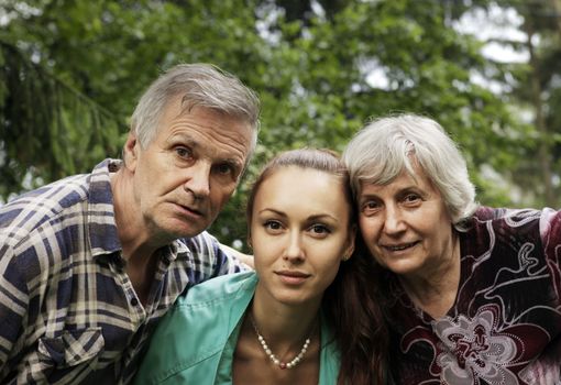 The granddaughter with the grandmother and the grandfather