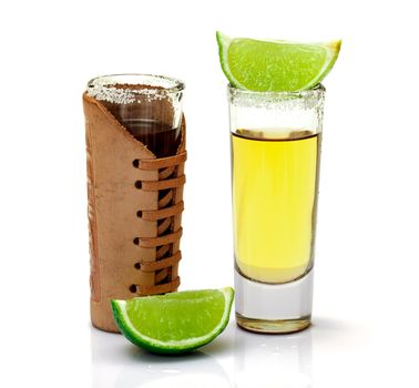 Shot of Gold Tequila with Slice Lime on white background