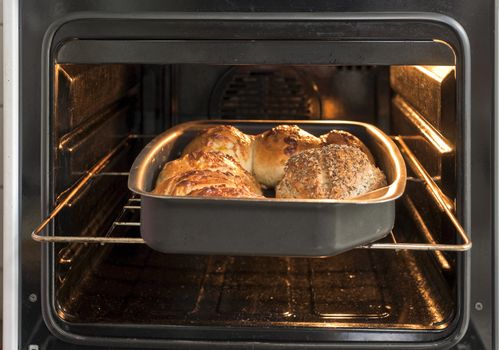 Bread on the metal cookie sheet in the oven