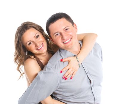 Closeup portrait of a sweet happy young couple smiling together. Isolated on white background