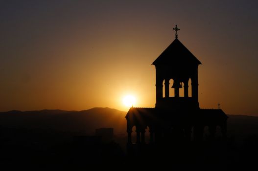 Sunset over the St. Trinity cathedral in Tbilisi, Georgia          