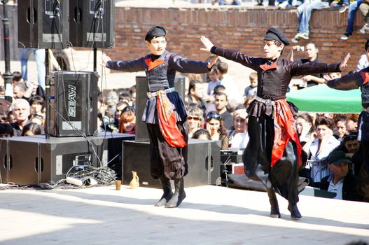 TBILISI, GEORGIA - OCTOBER 9: Participants of Georgian Folk Autumn Festival - Tbilisoba, in adjarian traditional costume dancing Ajaruli dance, October 9, 2011 in Tbilisi, Georgia.