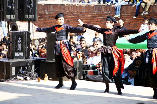 TBILISI, GEORGIA - OCTOBER 9: Participants of Georgian Folk Autumn Festival - Tbilisoba, in adjarian traditional costume dancing Ajaruli dance, October 9, 2011 in Tbilisi, Georgia.