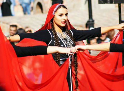 TBILISI, GEORGIA - OCTOBER 9: Participants of Georgian Folk Autumn Festival - Tbilisoba, in adjarian traditional costume dancing Ajaruli dance, October 9, 2011 in Tbilisi, Georgia.