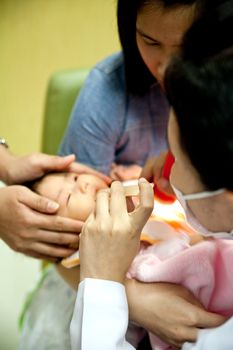 November4,2011:Doctor use the tool in the baby's neck.