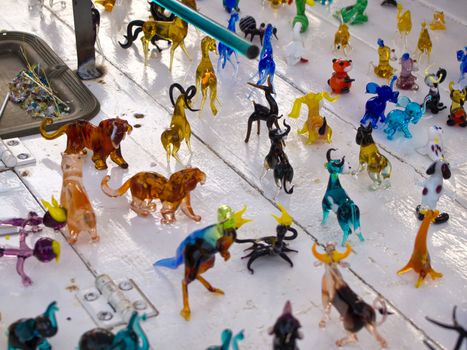 Colorful beautiful glass craft small animals figurines sculptures on display
