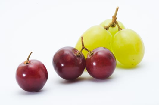 red and green grapes isolated on white