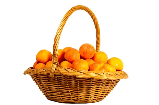 Basket with apricots, isolated on a white background.