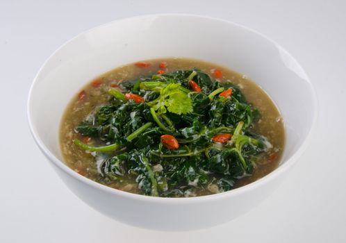 Vegetable soup on isolated white