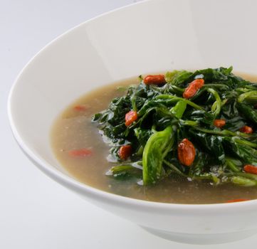 Vegetable soup on isolated white