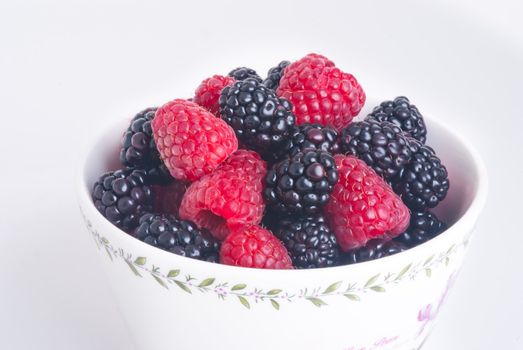 raspberry and blackberry on white isolated background