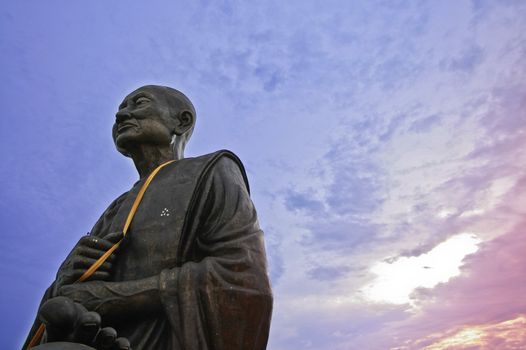 monk buddha sculpture in prachupkerekhan, thailand