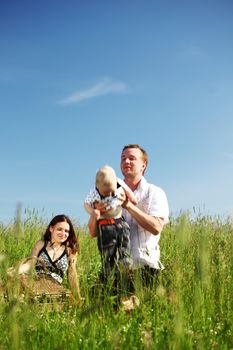 happy family in green grass