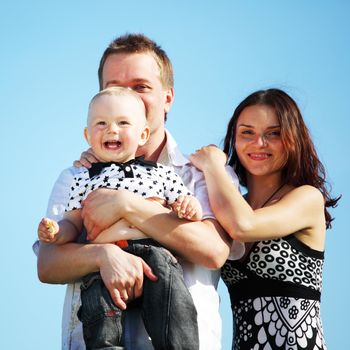 happy family blue sky on background