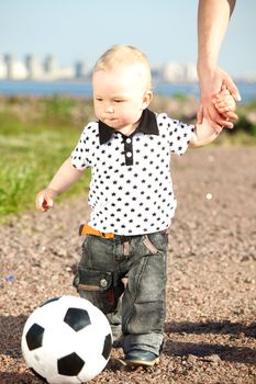 little boy play soccer outdoor