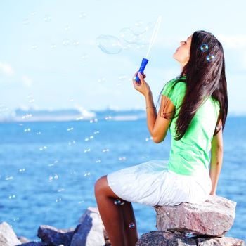 woman relax blue sea and bubbles on background