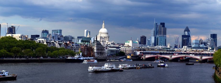 wide shot image from Waterloo bridge in London looking towards St Pauls cathedral.