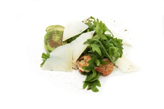 shrimp with arugula on a plate on a white background