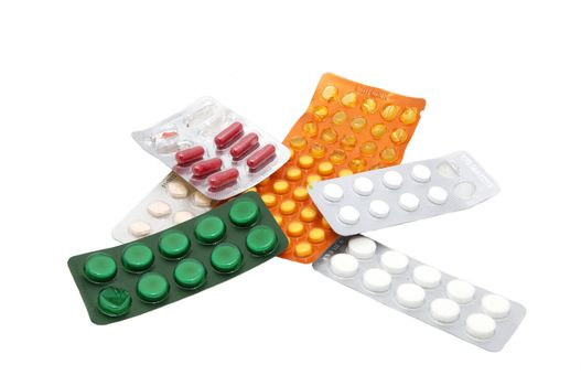 Packing medical pills over white background