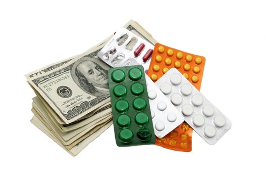 dollars and medical pills over white background