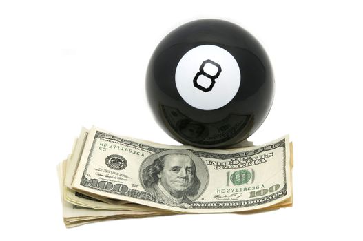 dollars and a billiard ball on a white background
