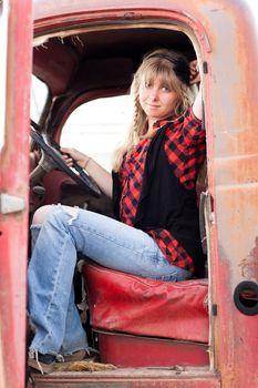 Pretty Blonde Girl in a Vintage old truck