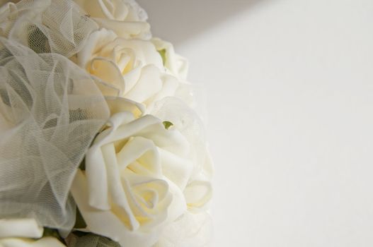 Wedding decoration - white roses bouquet, rings, bride and groom