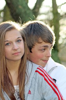 teenagers in the woods looking worried