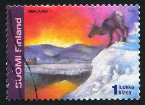 FINLAND - CIRCA 2002:  stamp printed by Finland, shows reindeer, northern lights, circa 2002