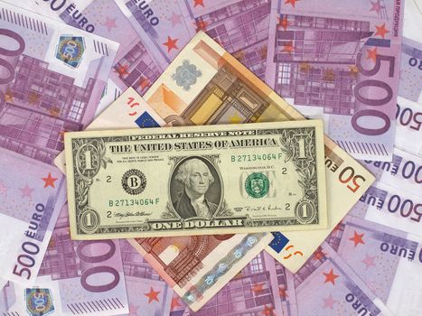 Dollars bill and lot euro banknotes as background.