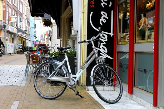 Bike is parked near  shop in Gorinchem. Netherlands