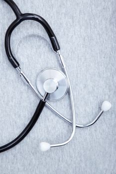 Medical stethoscope on a textured background. Close-up photo