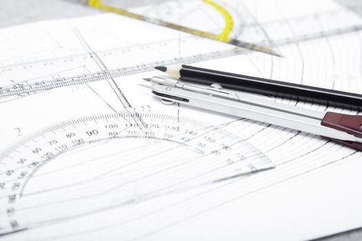 Scheme with compasses rulers and pencil. Close-up photo